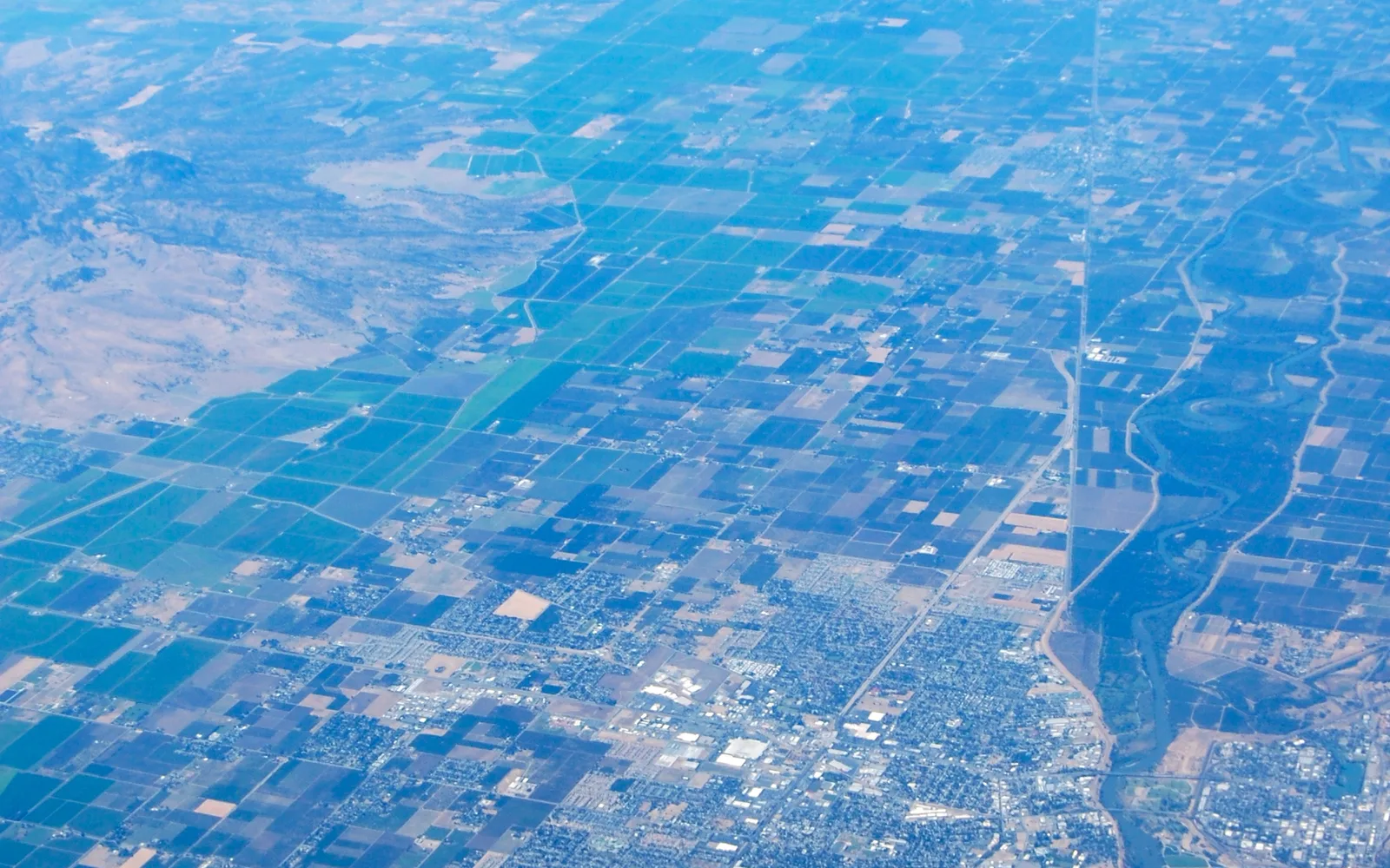 Aerial view of Yuba City with the Feather River visible cutting through the landscape